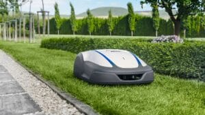 A robotic lawn mower is cutting grass in a garden.